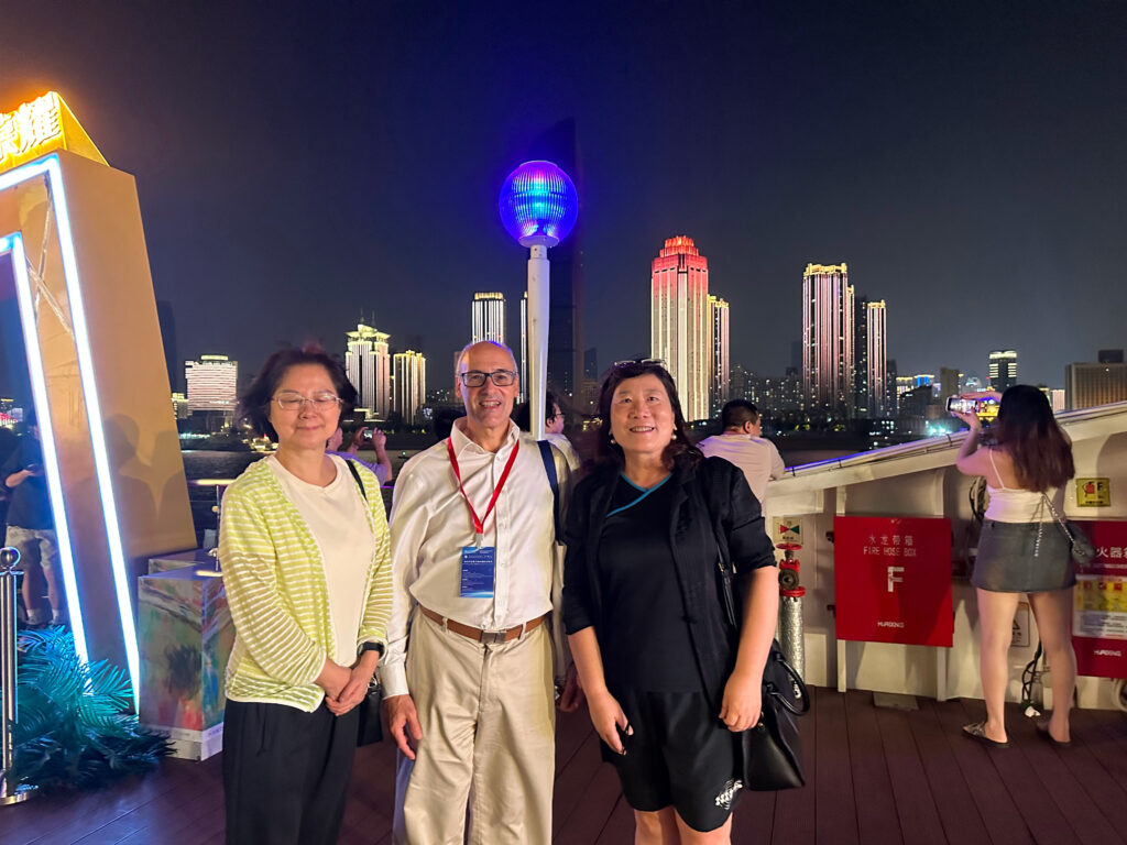 Jeremy (centre) enjoying the boat trip in Wuhan